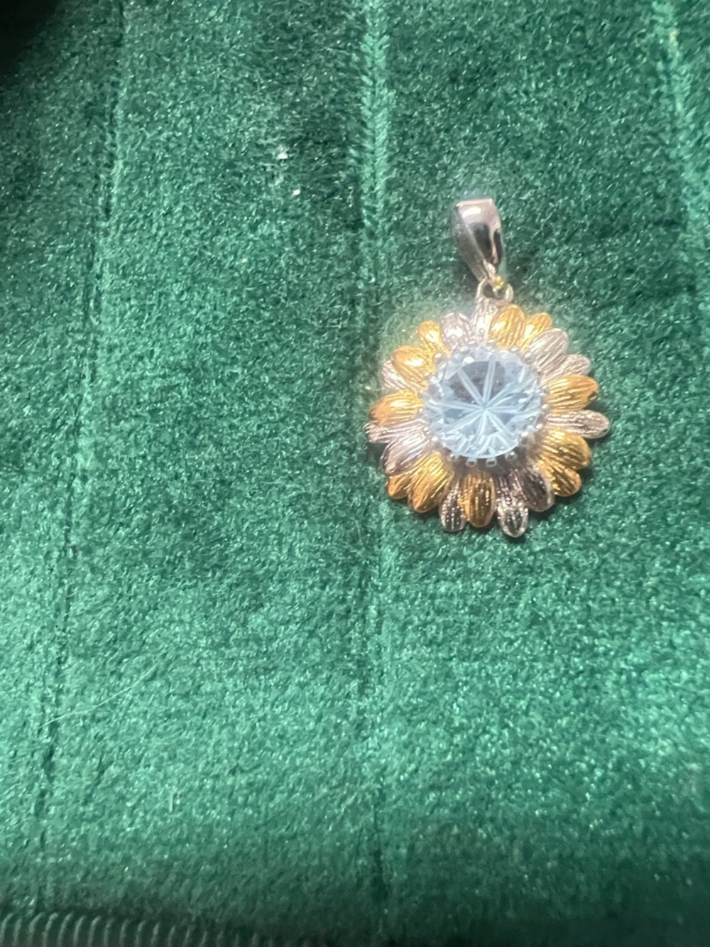 Gold and Silver Sunflower Pendant with Light Blue Topaz Center